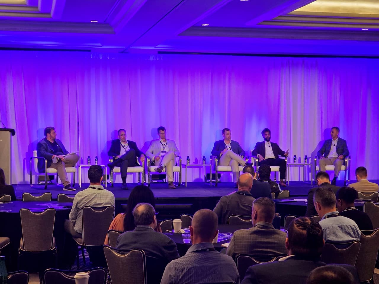 Mahmood Usmani speaking on a panel at IMN's Single-Family Rental East Forum in Miami.